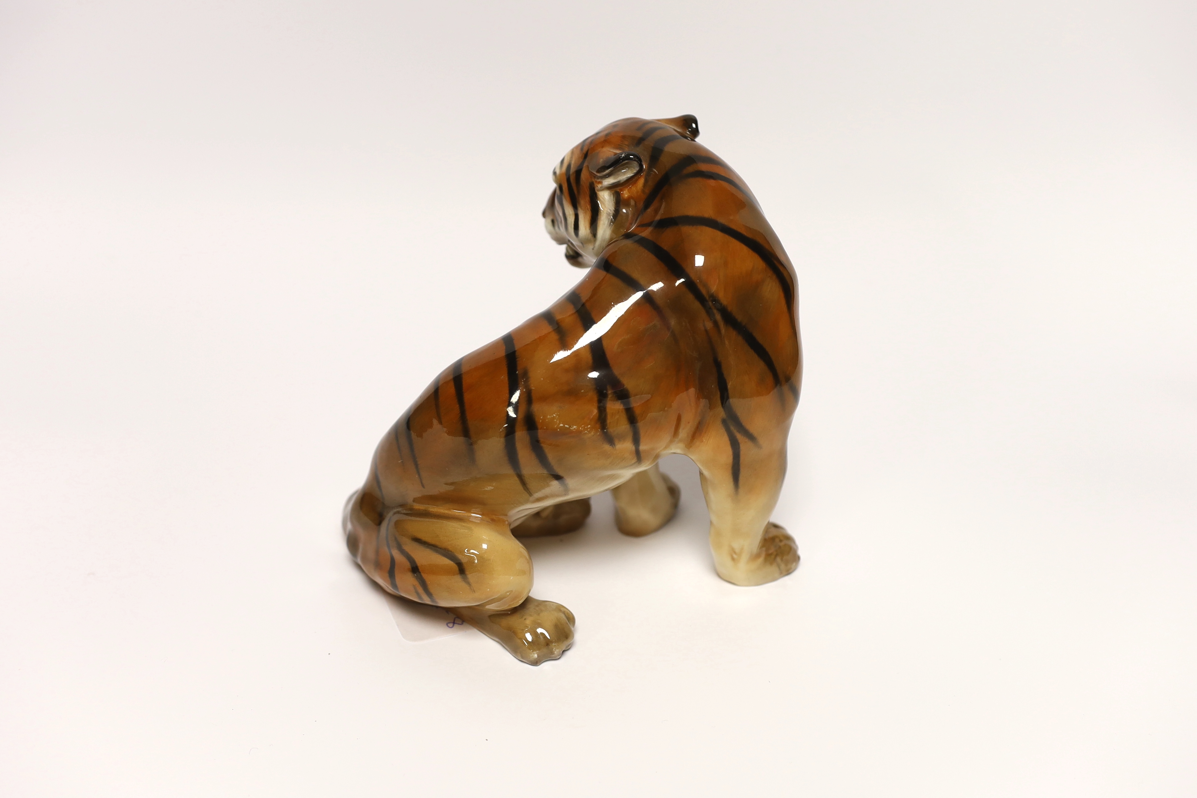 Charles Noke for Royal Doulton figure of a seated tiger HN 912, 16.5cm high